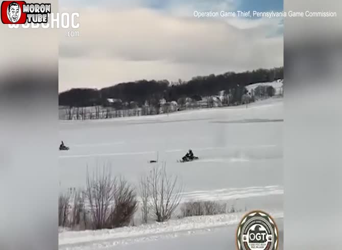 Video :On a frozen lake, two young snowmobilers intentionally struck a fox
